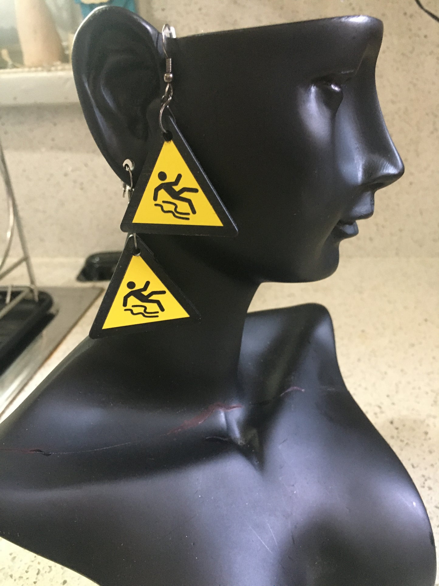 Slippery when wet sign dangles